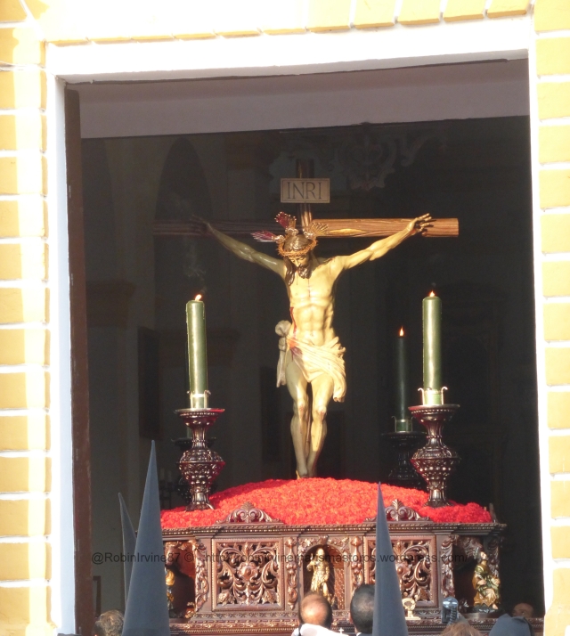 The image of Christ on the cross, borne by men of the town, sallies from the church on Holy Friday, the most important day of Holy Week for Villamanrique. The men need to be roughly of the same height as they bear the weight on the back of the necks/shoulders, with a special pad.